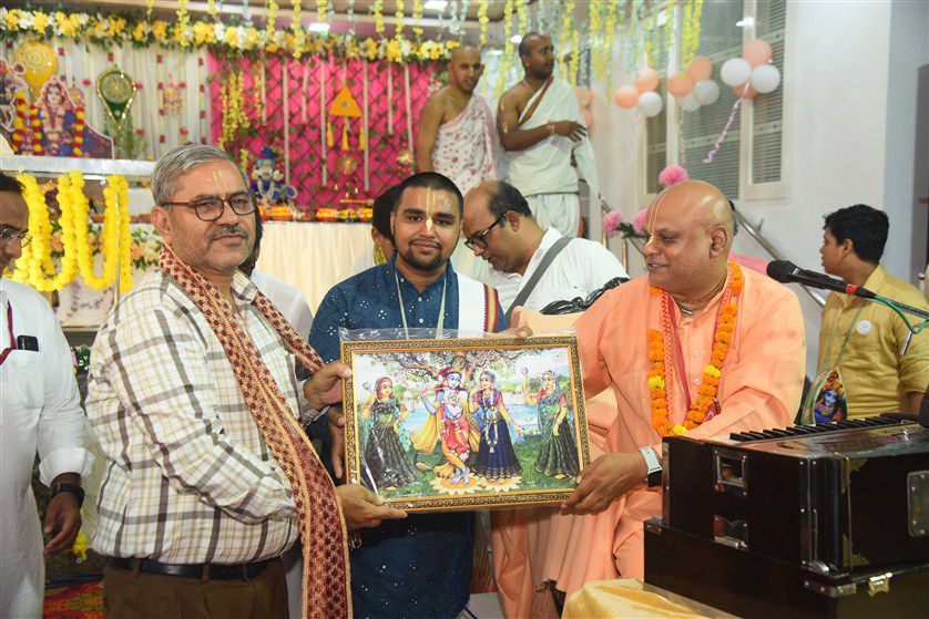 Devotees participating in ecstatic kirtan singing with traditional instruments