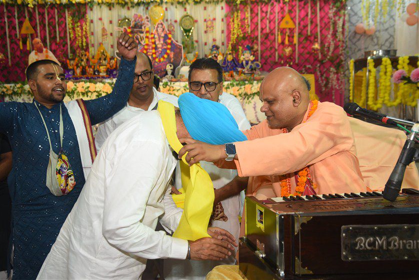 Spiritual discourse session with devotees listening attentively