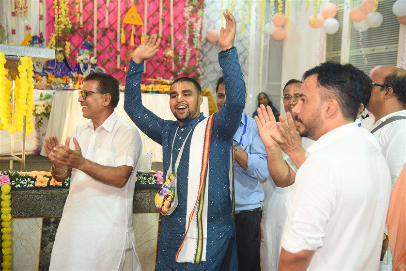 Festival celebration with colorful decorations and joyful devotees